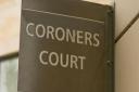 A sign for a coroners court