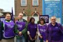 North Finchley library worker Cathy  Yilmaz, (far right) is joined by fellow public sector workers outside North Finchley Library this morning