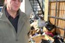 Graham Weston with the pile of rubbish which he has been trying to get removed.