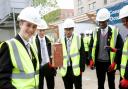 Brick in the wall: students on their tour of Acton Gardens