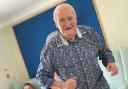 Cutting some shapes:  a resident gets into the swing of the party