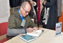 Signing session: Rory Cellan-Jones autographs copies of his latest book