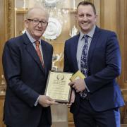 Honoured: Chris Kerr receives rgw Fox and Goose's award from the Fuller's chairman