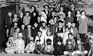 The 18th South West Herts Cub Pack in fancy dress for their Christmas Party, early 1930s