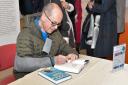 Signing session: Rory Cellan-Jones autographs copies of his latest book