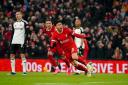 Wataru Endo (centre) was on target in Liverpool’s comeback win (Peter Byrne/PA)