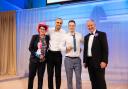 Green Doors founder Joseph Holman and Managing Director Levi Lucas accept award for Small Business of the Year, joined onstage by Minister for Small Business Kevin Hollinrake (right) and Sue Perkins