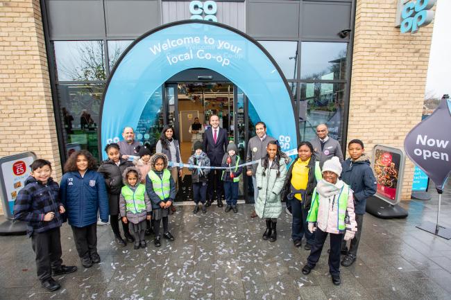 Opening day:  manager Jigar Patel with James Murray MP and Horsenden Primary School pupils