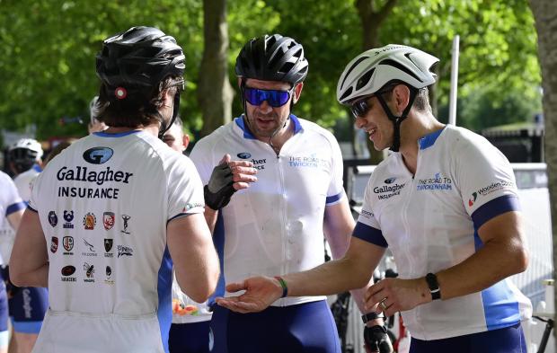 Ealing Times: Former Scottish international Nathan Hines embraces fellow riders at the finish