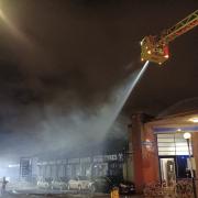 Evacuated: people from neighbouring homes and businesses were evacuated during the blaze