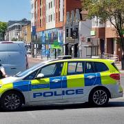 Crime scene: the Uxbridge Road cordoned off with the pub in the background. Photo: Mark Percy