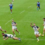 Elliott Whitehead of England touches down to score their side's seventh try during the Rugby League World Cup 2021 Pool A match between England and Samoa at St. James Park