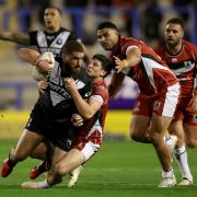 Kenneath Bromwich of New Zealand is tackled by Mitchell Moses of Lebanon during the Rugby League World Cup 2021 Pool C match between New Zealand and Lebanon
