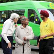 Welcome aboard: Driver Amarjit Kundi greets passengers on one of the familiar ECT green buses