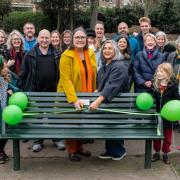 Benchmark: Julie Bentley (centre, with scissors) assisted to her left by Heena Johnson, director of Ealing, Hammersmith & Hounslow Samaritans, cuts the ribbon in Lammas Park