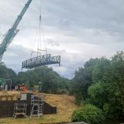 Down a bit! The new bridge is lowered into place. Photo: Friends of Grand Union Canal