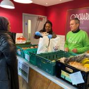 All hands to the wheel: food donations are prepared at the Orchard Cafe