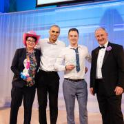 Green Doors founder Joseph Holman and Managing Director Levi Lucas accept award for Small Business of the Year, joined onstage by Minister for Small Business Kevin Hollinrake (right) and Sue Perkins