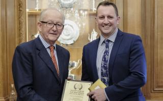 Honoured: Chris Kerr receives rgw Fox and Goose's award from the Fuller's chairman